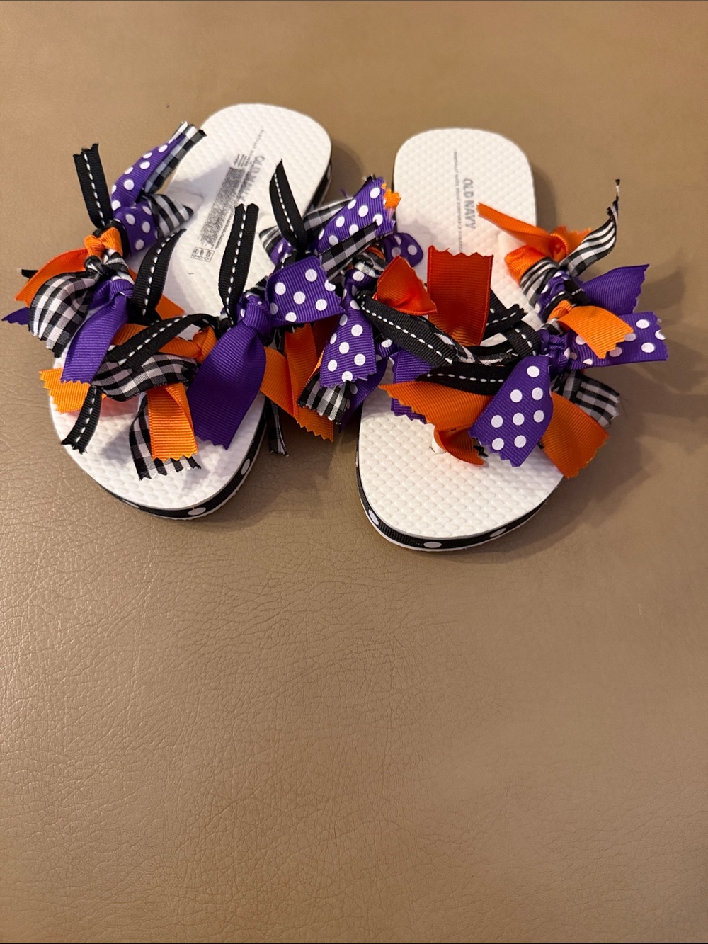 Old Navy White Flip Flops with Purple, Orange & Black Ribbon Bows